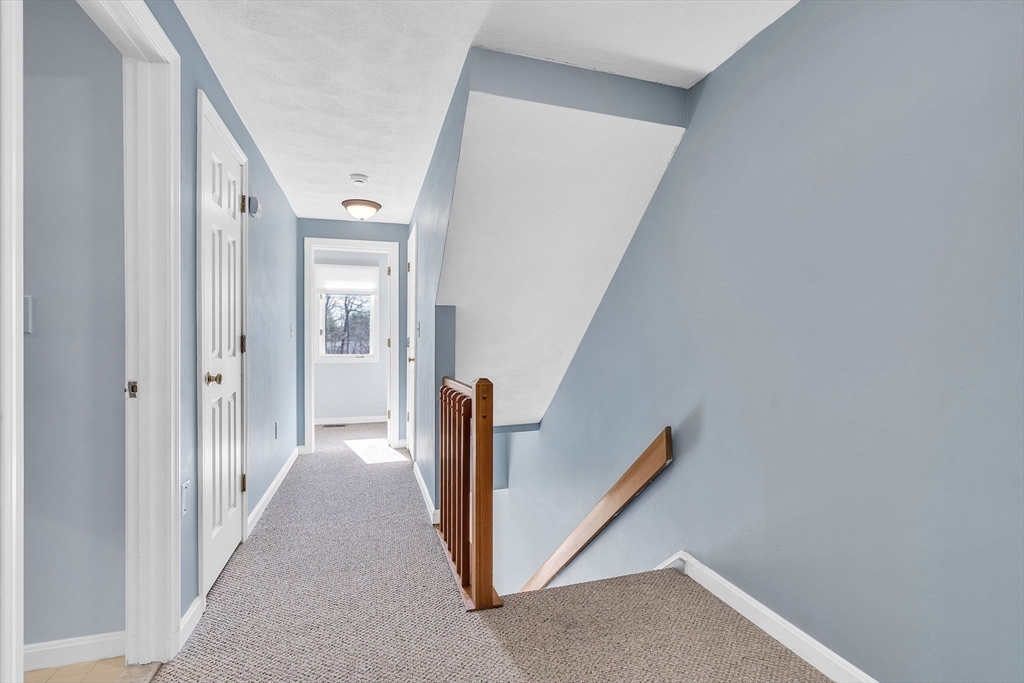 7 Deer Path, Unit 2 Maynard, MA 01754 - Photo 21 of 42 a view of a hallway view with staircase