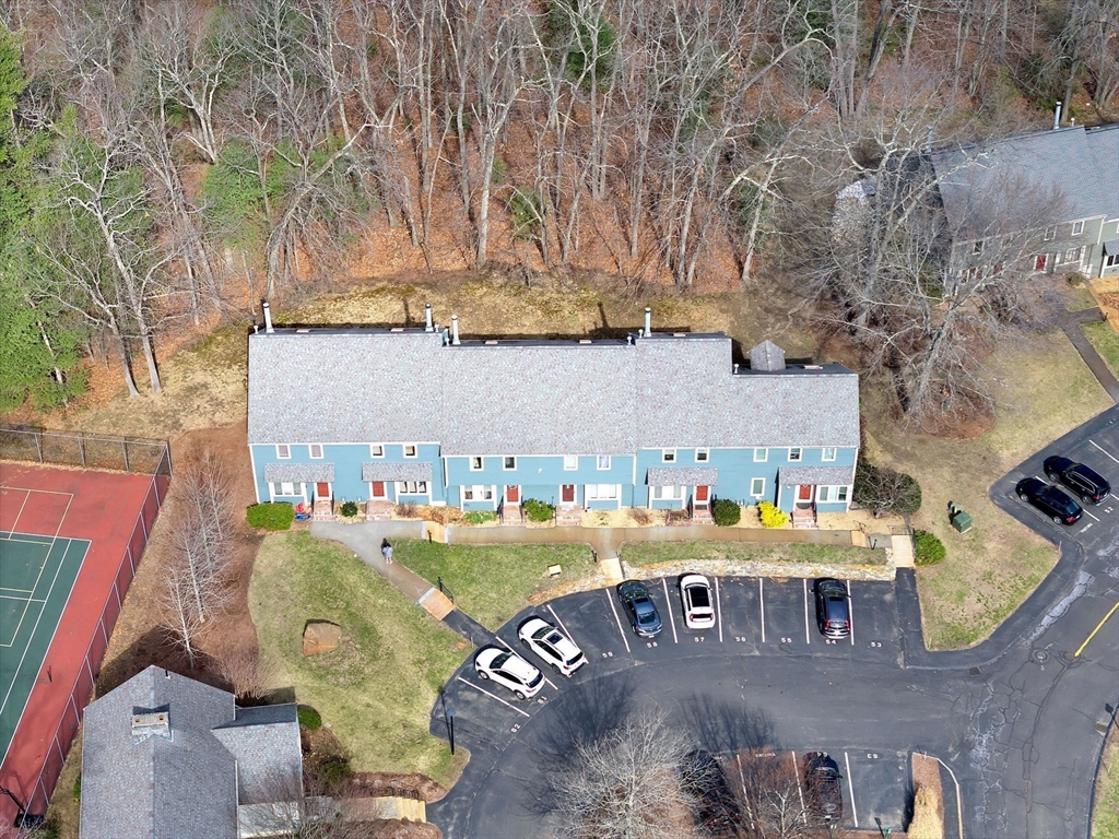 7 Deer Path, Unit 2 Maynard, MA 01754 - Photo 37 of 42 an aerial view of a chairs and table on the patio