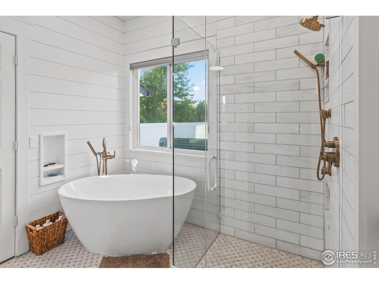 301 Pelican Cove Windsor, CO 80550 - Photo 15 of 38 a white bath tub sitting in a bathroom