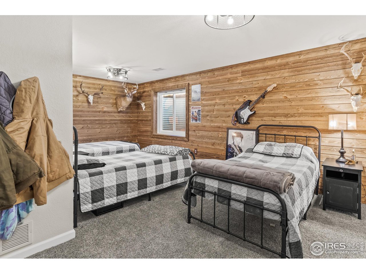 301 Pelican Cove Windsor, CO 80550 - Photo 22 of 38 a bedroom with a bed next to a window