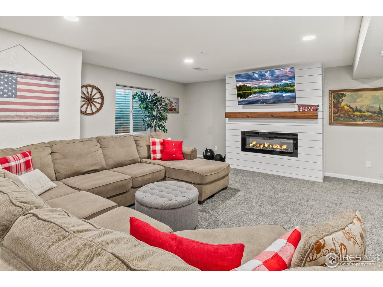 301 Pelican Cove Windsor, CO 80550 - Photo 24 of 38 a living room with furniture and a fireplace