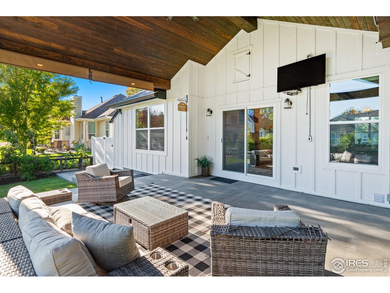 301 Pelican Cove Windsor, CO 80550 - Photo 25 of 38 a front view of a house with garden