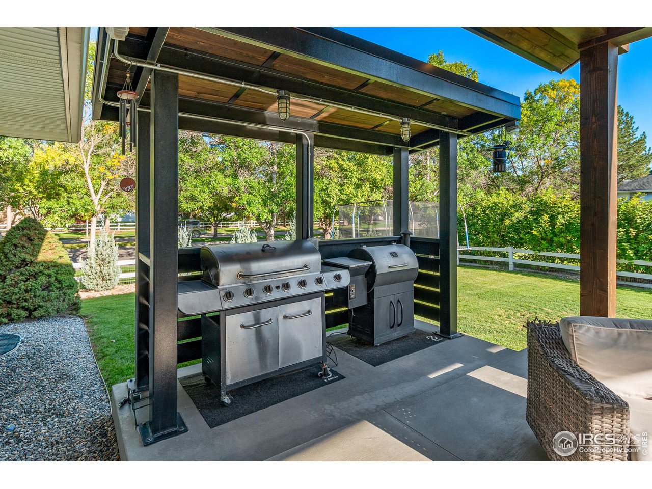 301 Pelican Cove Windsor, CO 80550 - Photo 26 of 38 a kitchen view with a stove and a garden