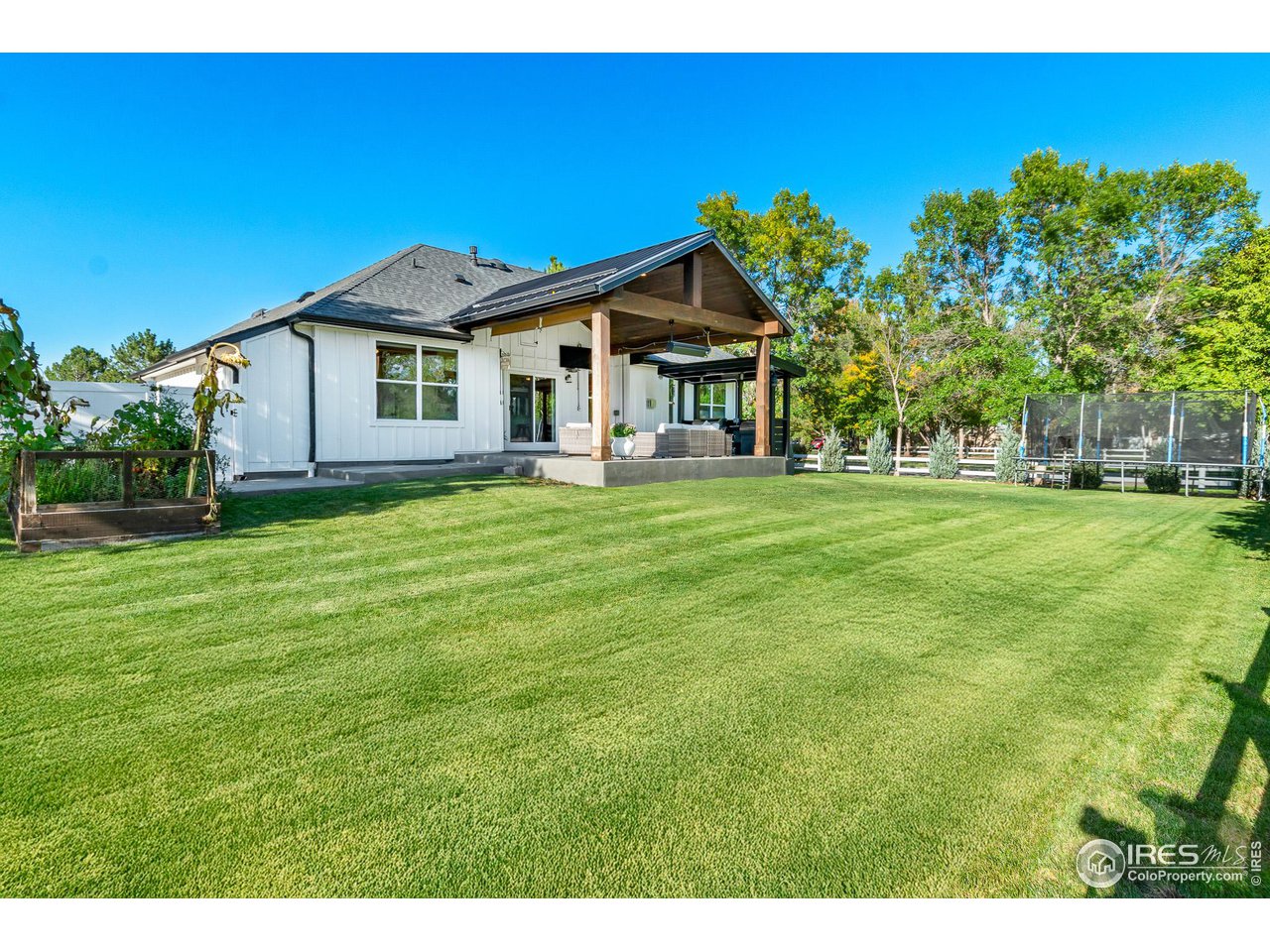 301 Pelican Cove Windsor, CO 80550 - Photo 28 of 38 a front view of a house with a yard