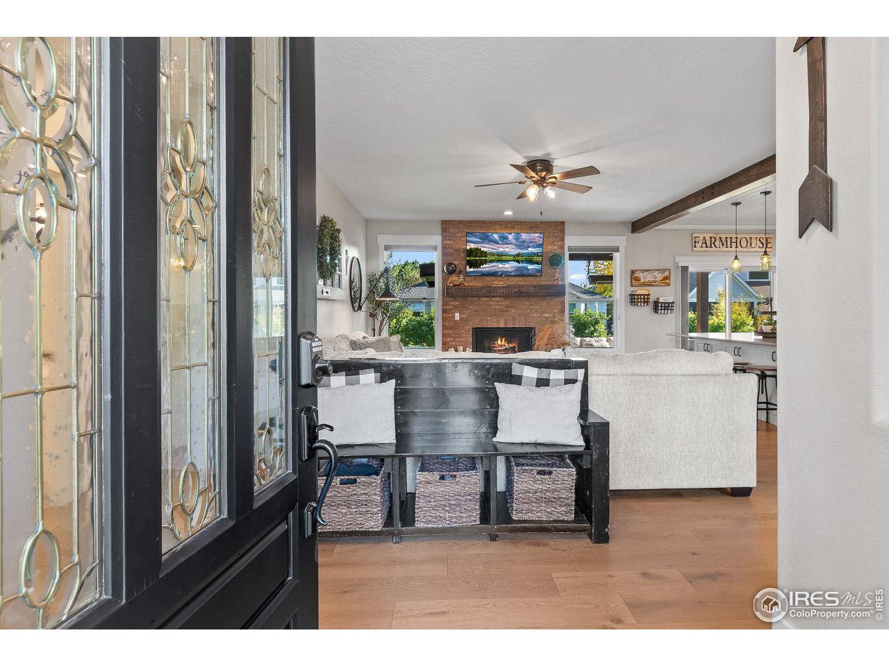 301 Pelican Cove Windsor, CO 80550 - Photo 4 of 38 a dining room with kitchen island furniture and a chandelier