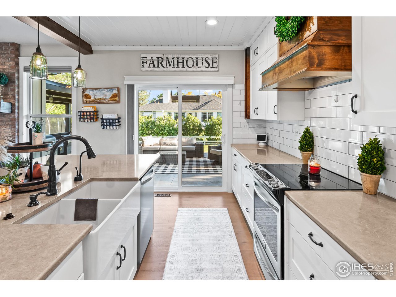 301 Pelican Cove Windsor, CO 80550 - Photo 9 of 38 a kitchen with stainless steel appliances granite countertop a sink stove and cabinets
