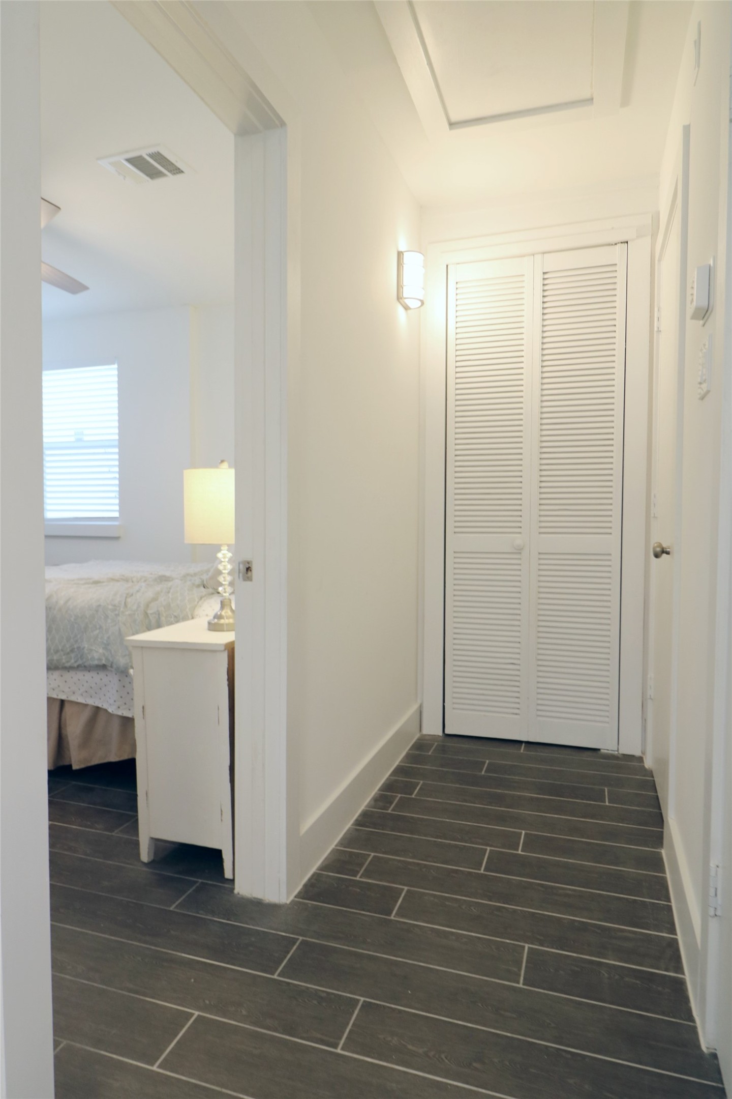 412 Pacific Street, Unit 2E Houston, TX 77006 - Photo 7 of 13 a view of a hallway with closet and utility room