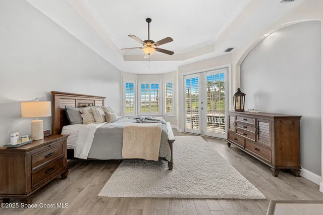 a large white kitchen with cabinets