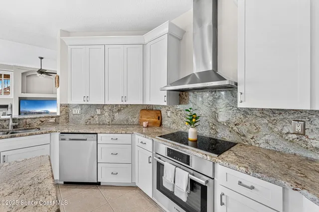 a kitchen that has a lot of cabinets in it