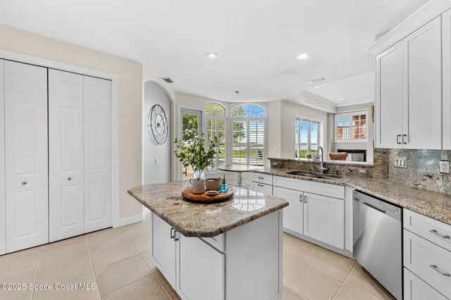a living room with furniture a window and a fireplace