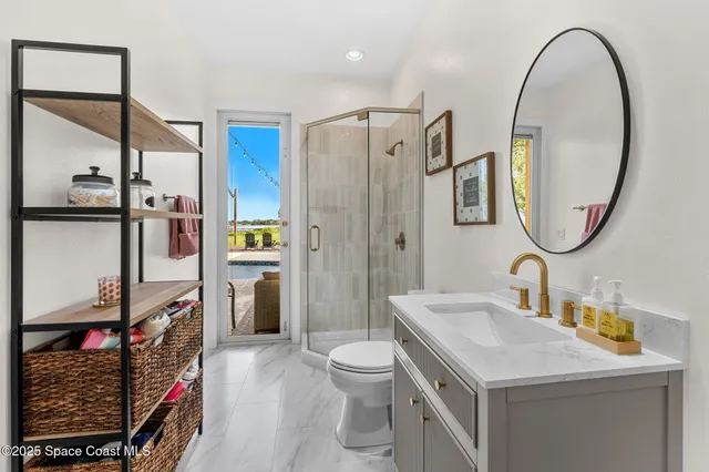 a living room with furniture fireplace and chandelier