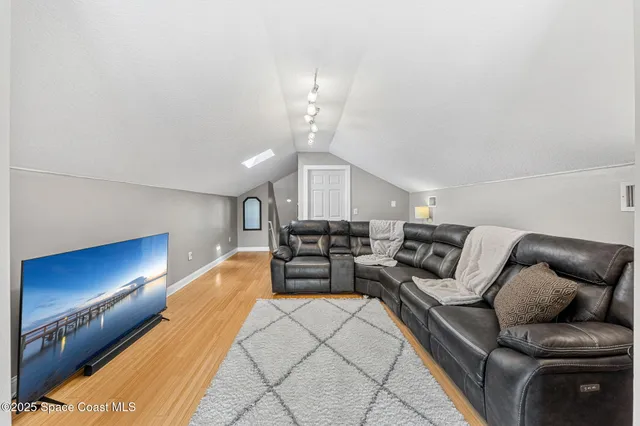 a room with gym equipment and windows