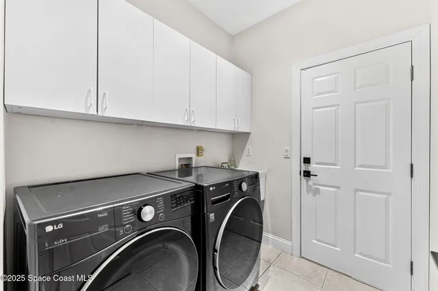 a view of a balcony with wooden floor and outdoor seating