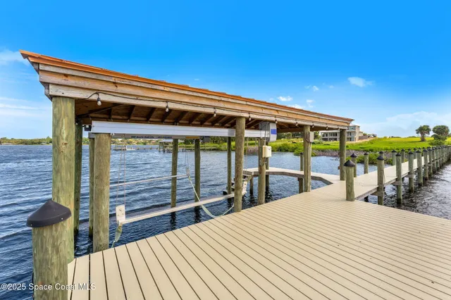 a view of swimming pool with outdoor seating and a garden