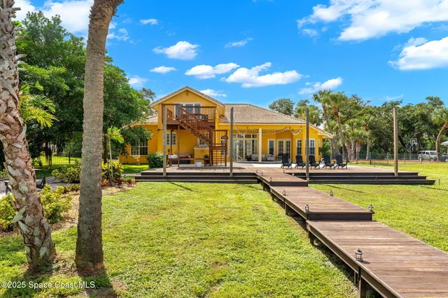 a view of a sign under a tree