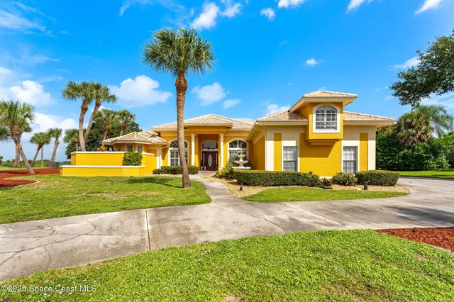 a bed room with a bed and a chandelier