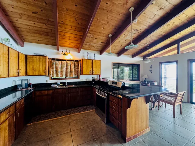 a kitchen with a sink and wooden cabinets