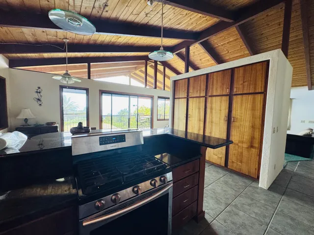 a view of a dining room with furniture and a window