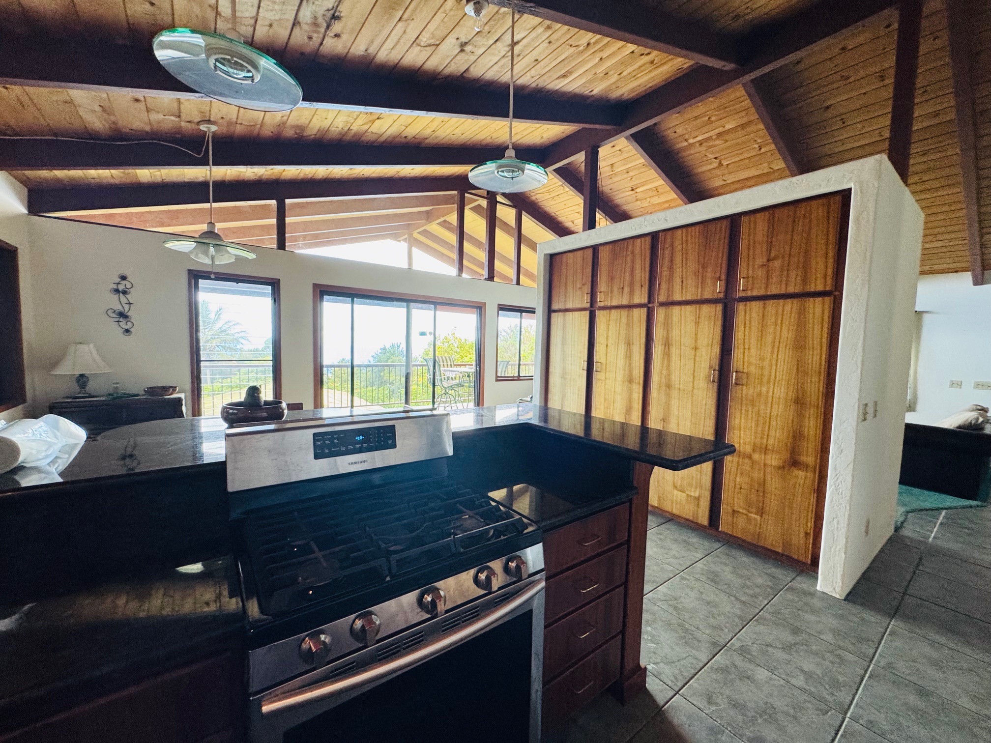 84-1164 Bruner Road Captain Cook, HI 96704 - Photo 9 of 13 a view of a dining room with furniture and a window