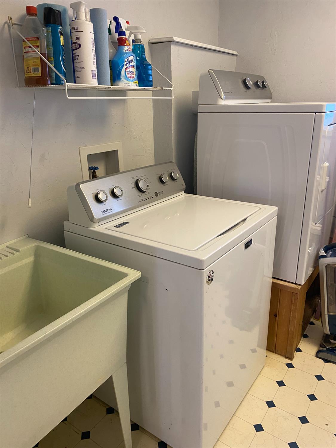 5021 Banbury Cross Road Shingle Springs, CA 95682 - Photo 44 of 92 The laundry room with it's linoleum floor, washer & elevated dryer and sink on one side!