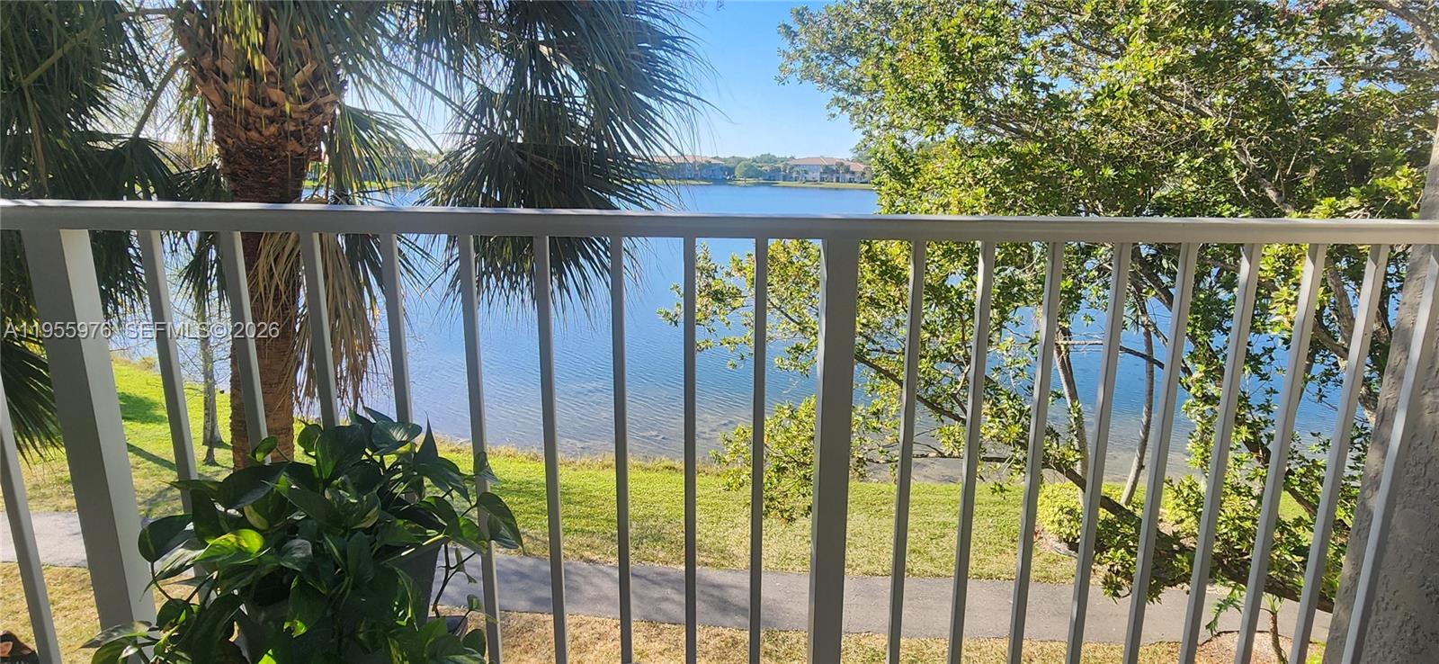 a view of a balcony with plants