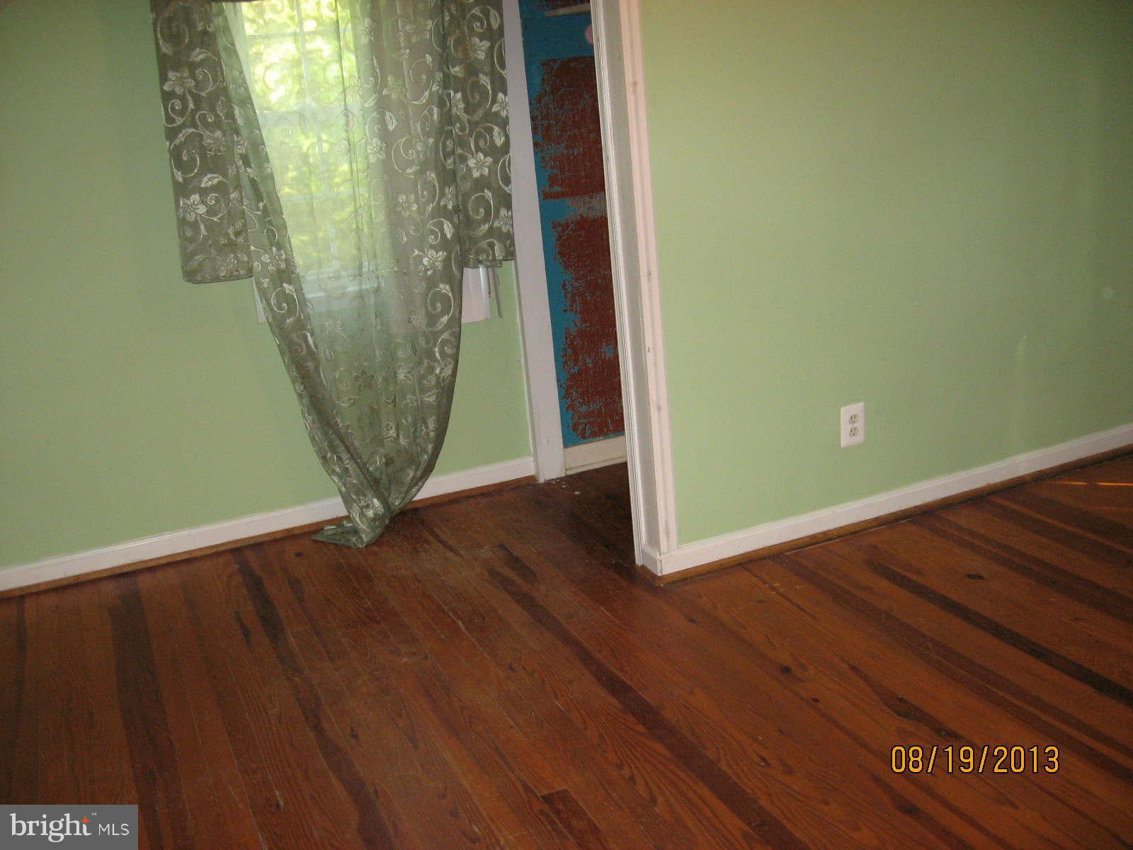 315 Bryants Nursery Road Silver Spring, MD 20905 - Photo 14 of 24 a view of a room with wooden floor and a window
