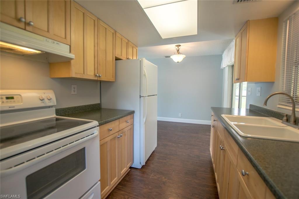 18584 Flamingo Road Fort Myers, FL 33967 - Photo 4 of 11 a kitchen with a sink stove and refrigerator