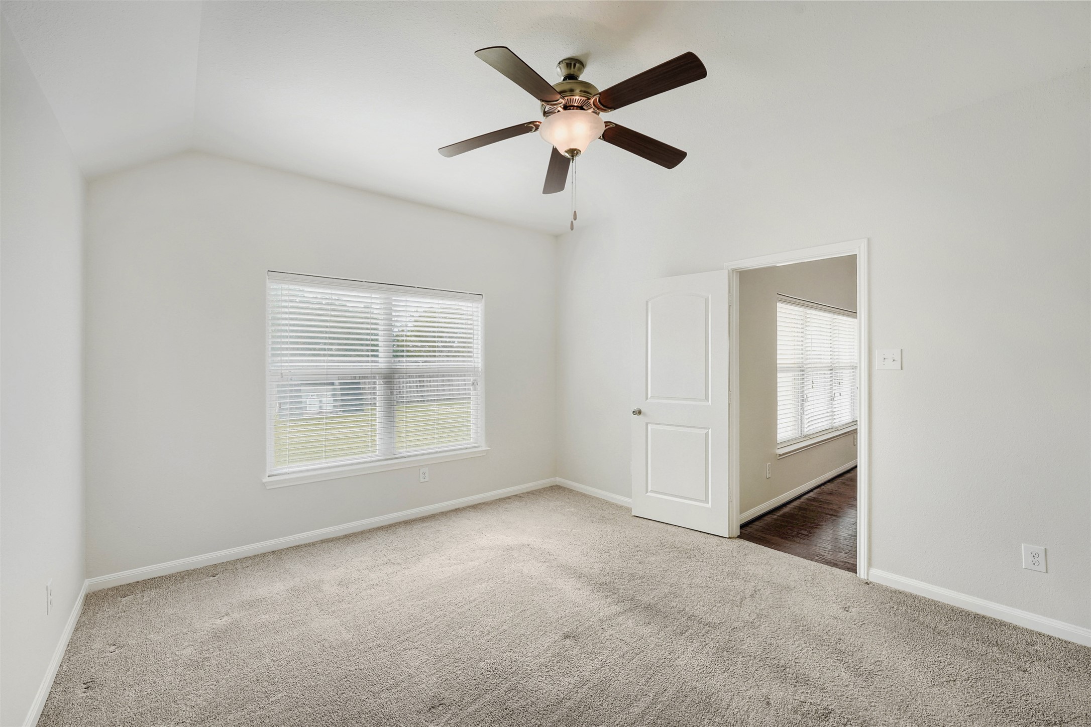 13408 Clara Martin Road Manor, TX 78653 - Photo 15 of 27 an empty room with windows and fan
