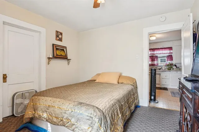 a bedroom with a bed and furniture