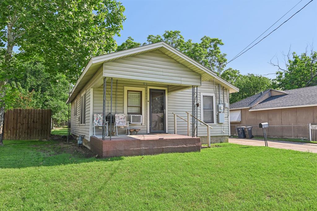 2509 Bird Street Fort Worth, TX 76111 - Photo 2 of 30 a front view of house with a garden