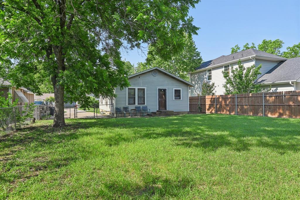 2509 Bird Street Fort Worth, TX 76111 - Photo 25 of 30 a view of a yard in front of a house with large tree