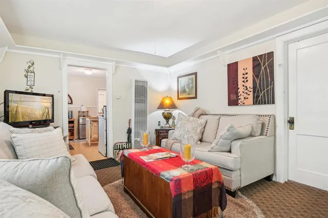 a living room with a couch and a flat screen tv