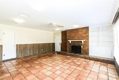 2517 33rd Street Lubbock, TX 79410 - Photo 14 of 50 a view of an empty room with a fireplace