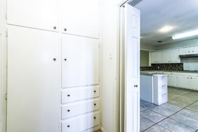 2517 33rd Street Lubbock, TX 79410 - Photo 27 of 50 a view of kitchen with refrigerator and white cabinets