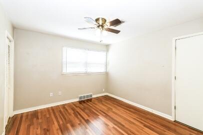 2517 33rd Street Lubbock, TX 79410 - Photo 40 of 50 a view of a room with wooden floor and a ceiling fan