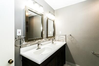 2517 33rd Street Lubbock, TX 79410 - Photo 45 of 50 a bathroom with a sink and a mirror