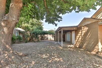 2517 33rd Street Lubbock, TX 79410 - Photo 6 of 50 a view of a house with a tree in the yard