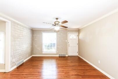 2517 33rd Street Lubbock, TX 79410 - Photo 9 of 50 a view of an empty room with wooden floor and a window