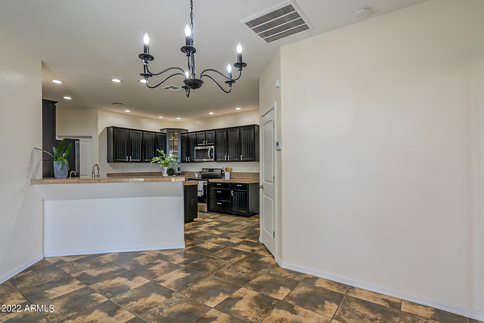 14928 South Tuthill Road Buckeye, AZ 85326 - Photo 7 of 50 Dining Room and Kitchen