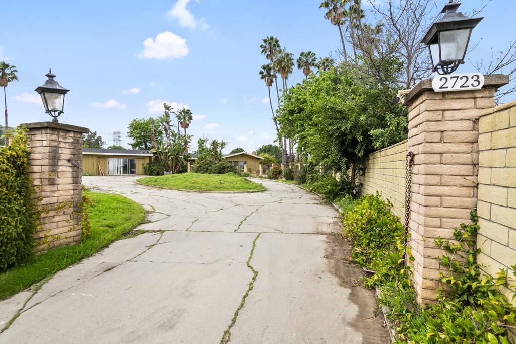 2723 Batson Avenue Rowland Heights, CA 91748 - Photo 1 of 37 a front view of a house with a yard and potted plants