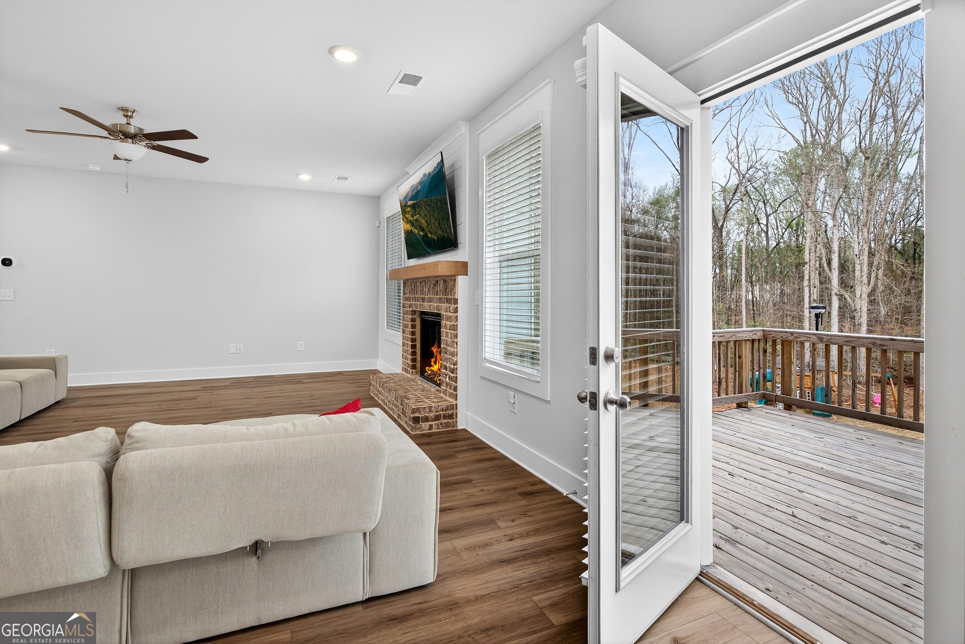 299 Saddleridge Trail Senoia, GA 30276 - Photo 19 of 56 a bedroom with a bed and a large window