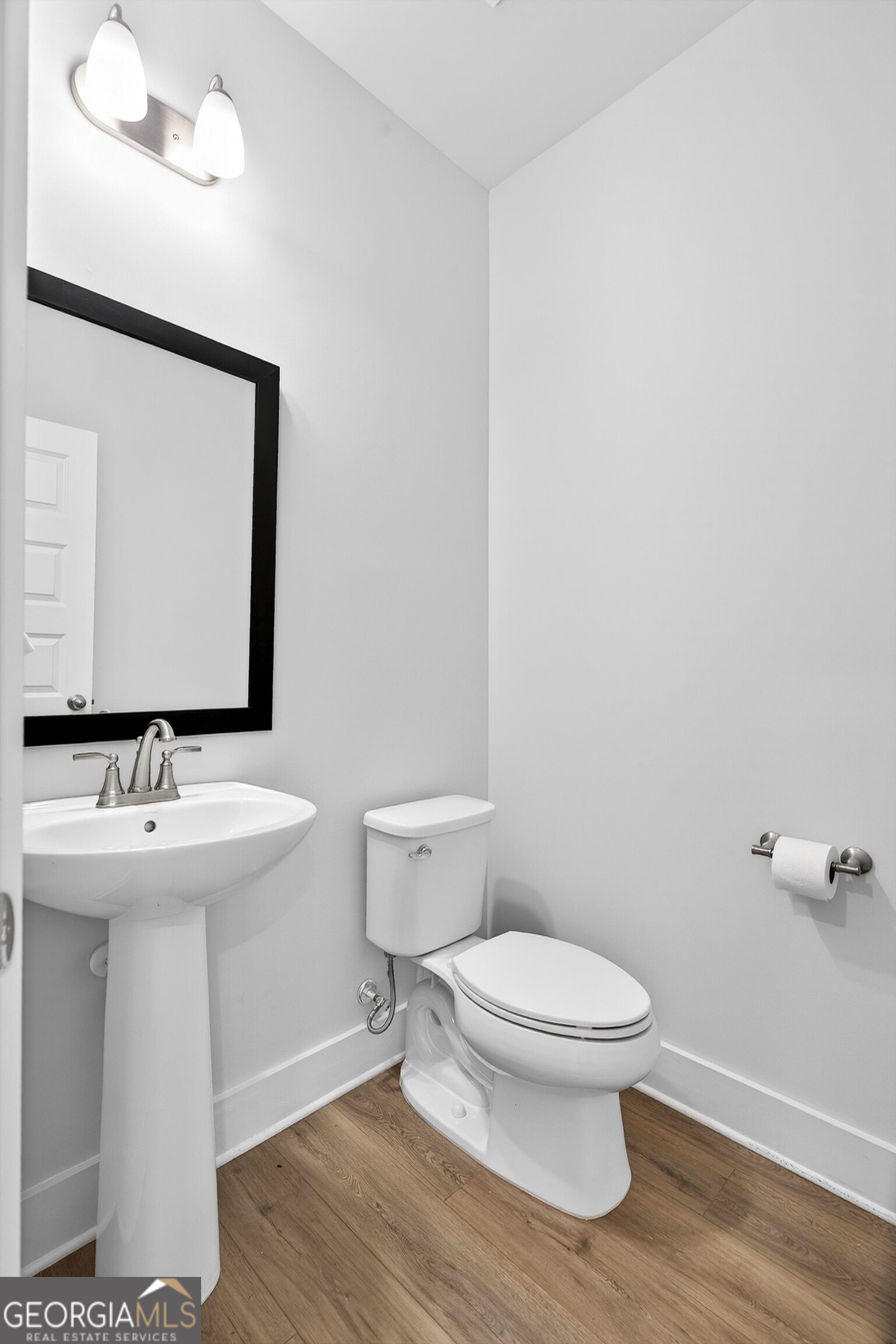 299 Saddleridge Trail Senoia, GA 30276 - Photo 22 of 56 a bathroom with a toilet a sink and mirror