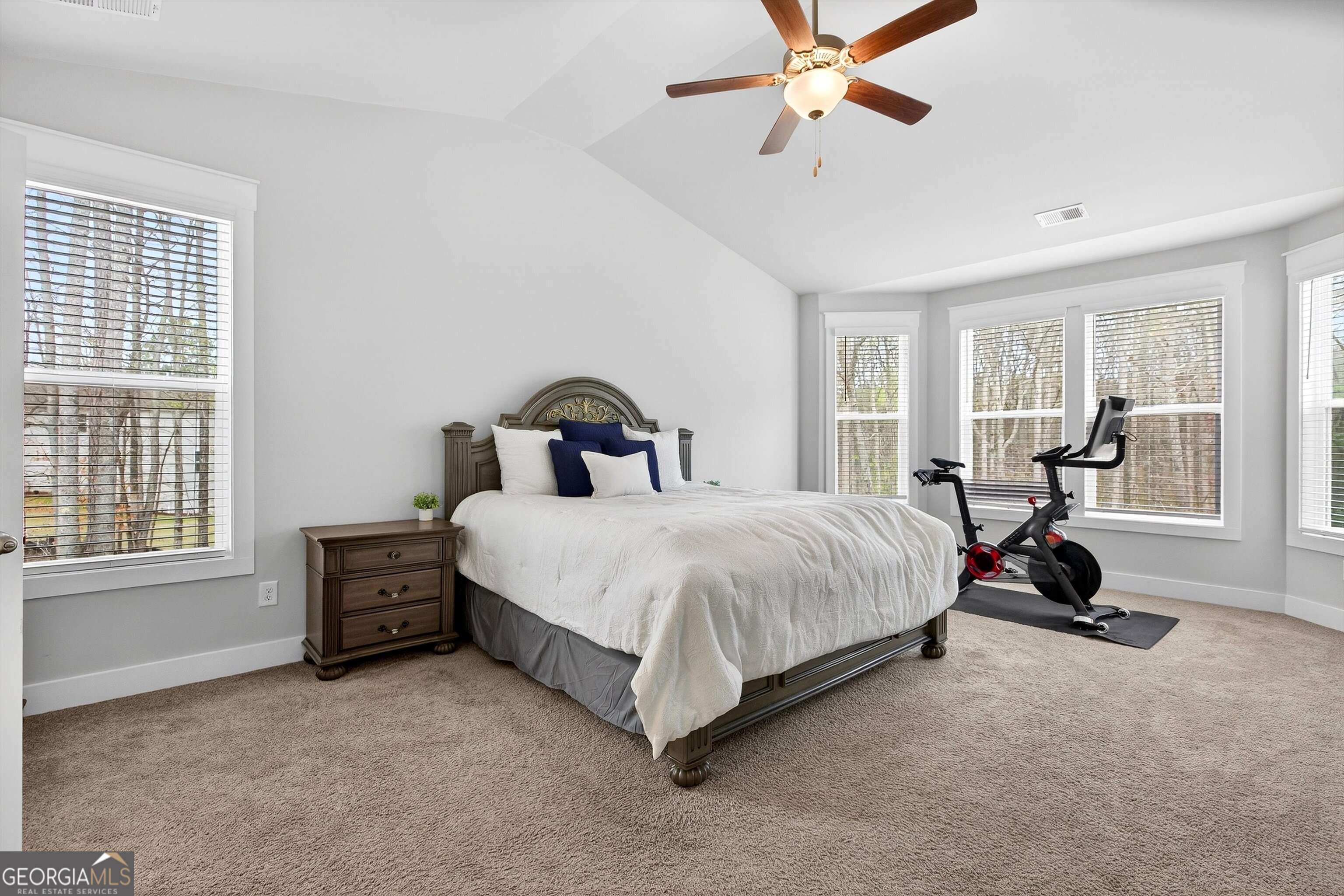299 Saddleridge Trail Senoia, GA 30276 - Photo 23 of 56 a bedroom with a bed chair and window