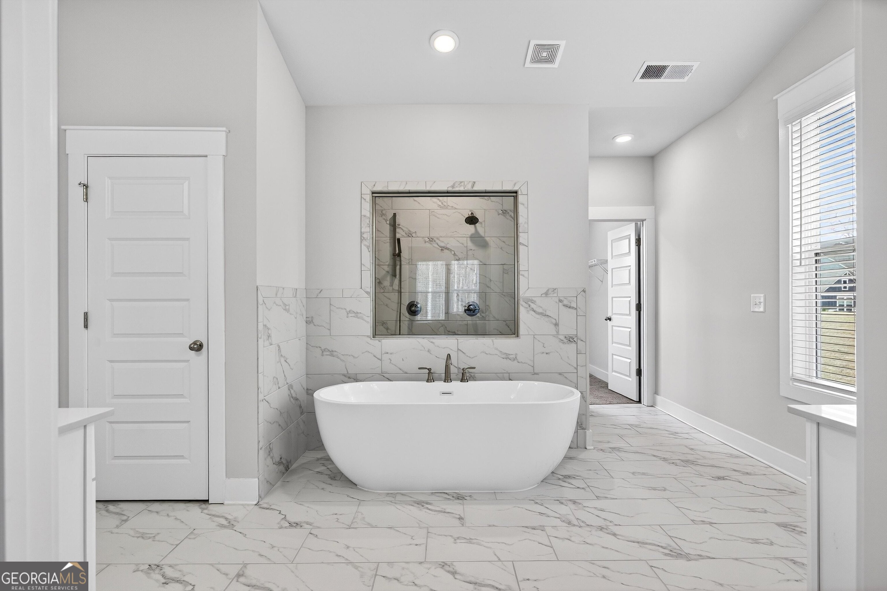 299 Saddleridge Trail Senoia, GA 30276 - Photo 25 of 56 a spacious bathroom with a bathtub and shower