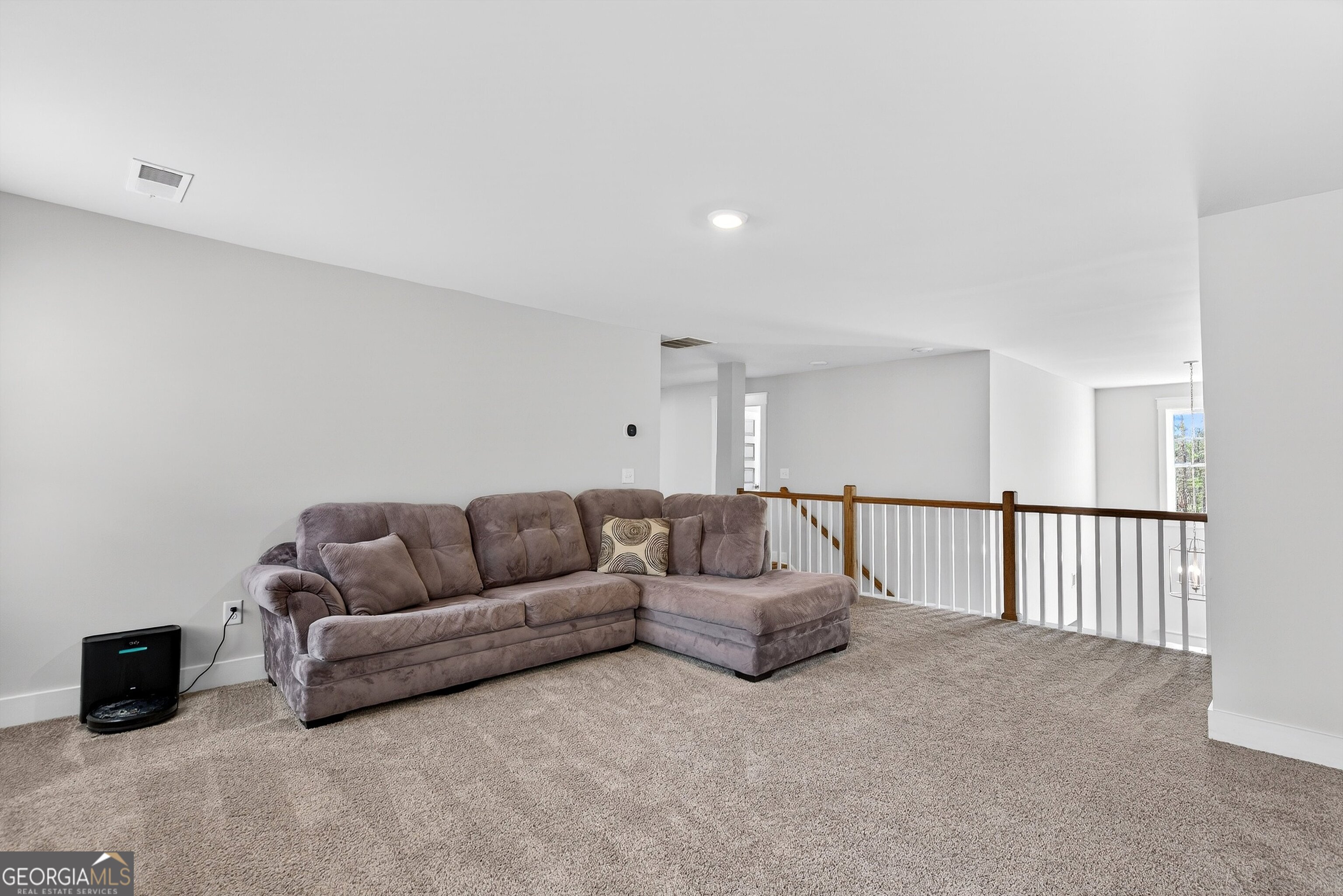 299 Saddleridge Trail Senoia, GA 30276 - Photo 35 of 56 a living room with furniture and a window