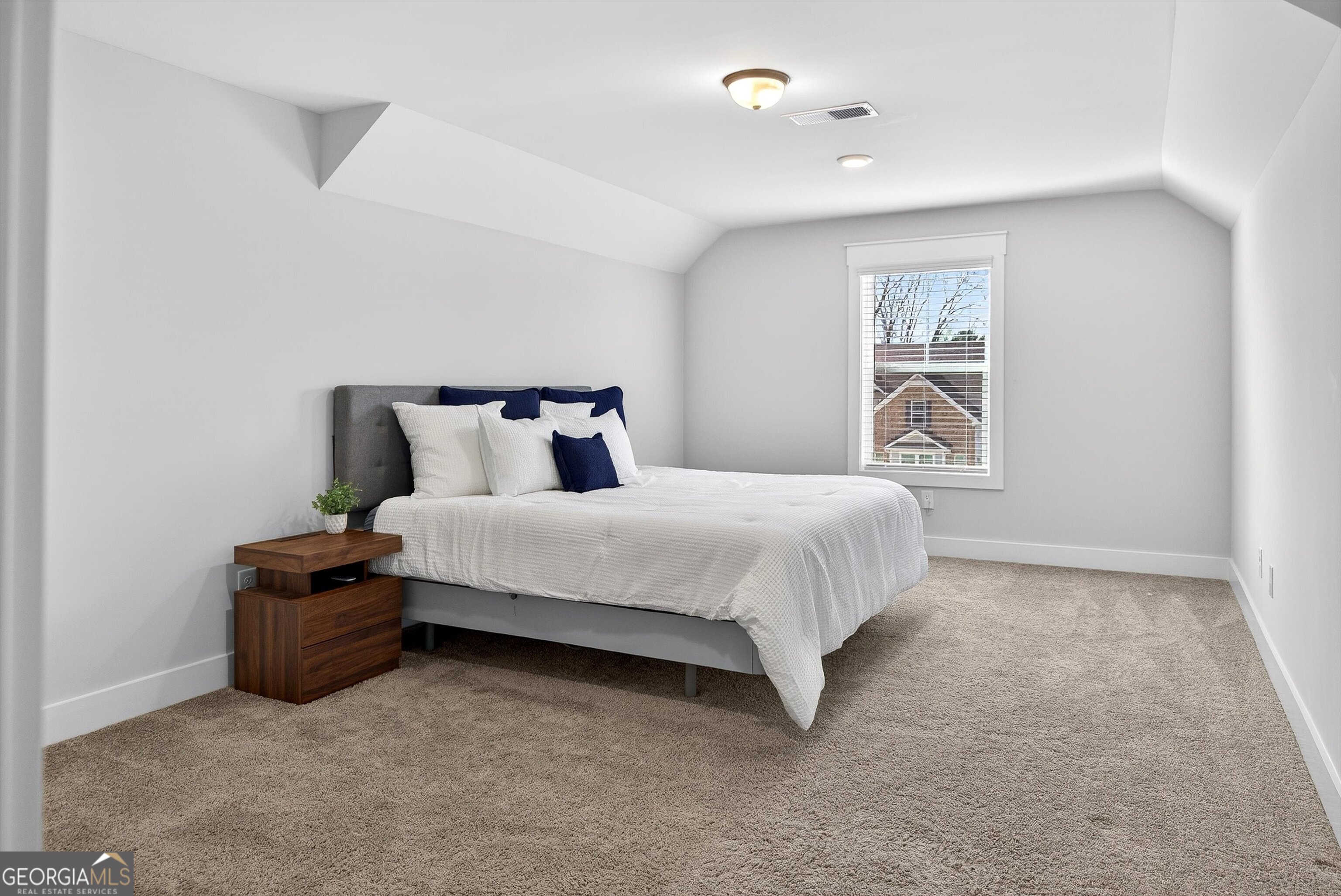 299 Saddleridge Trail Senoia, GA 30276 - Photo 36 of 56 a bedroom with a bed and a painting on the wall
