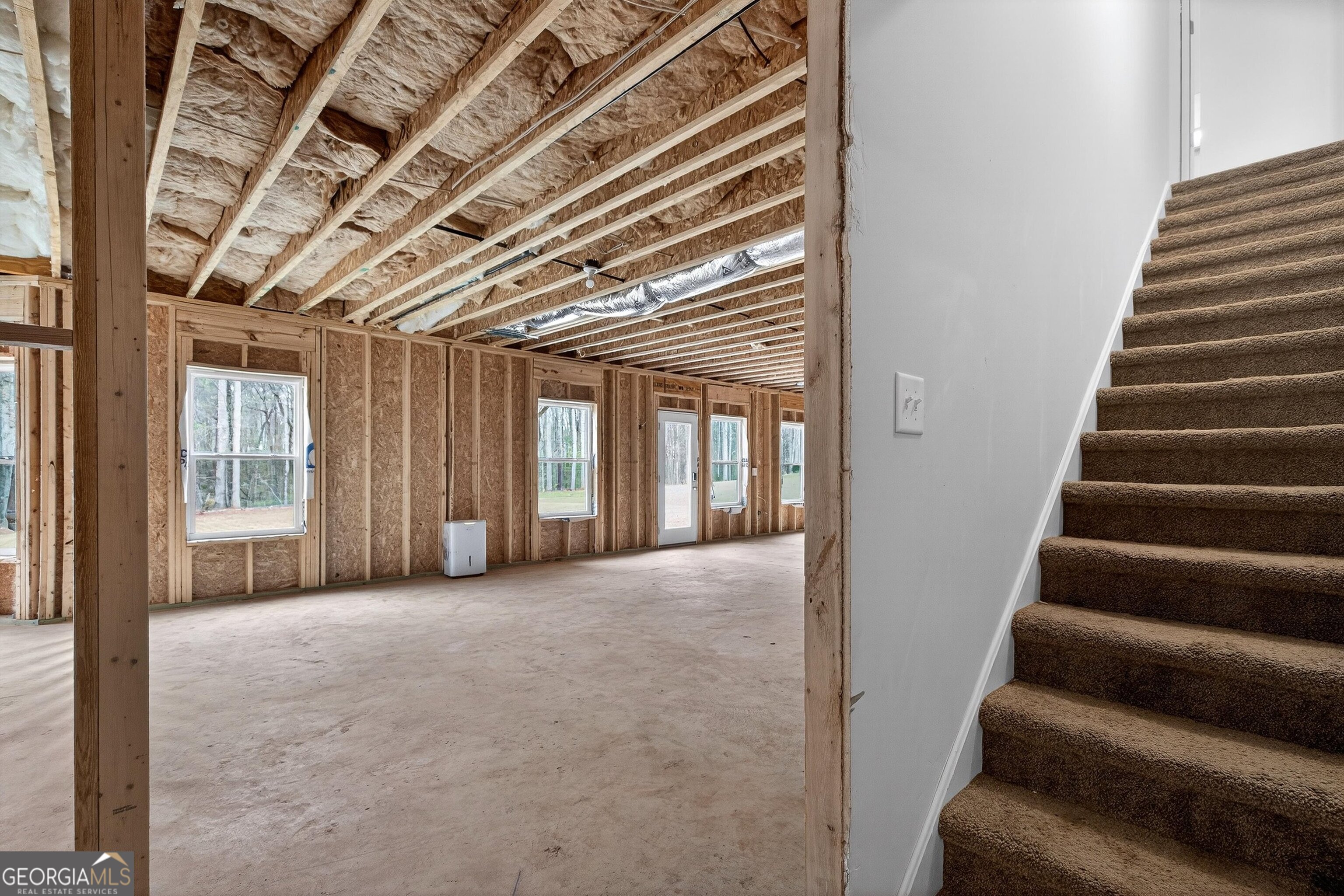 299 Saddleridge Trail Senoia, GA 30276 - Photo 43 of 56 a view of an empty room with stairs