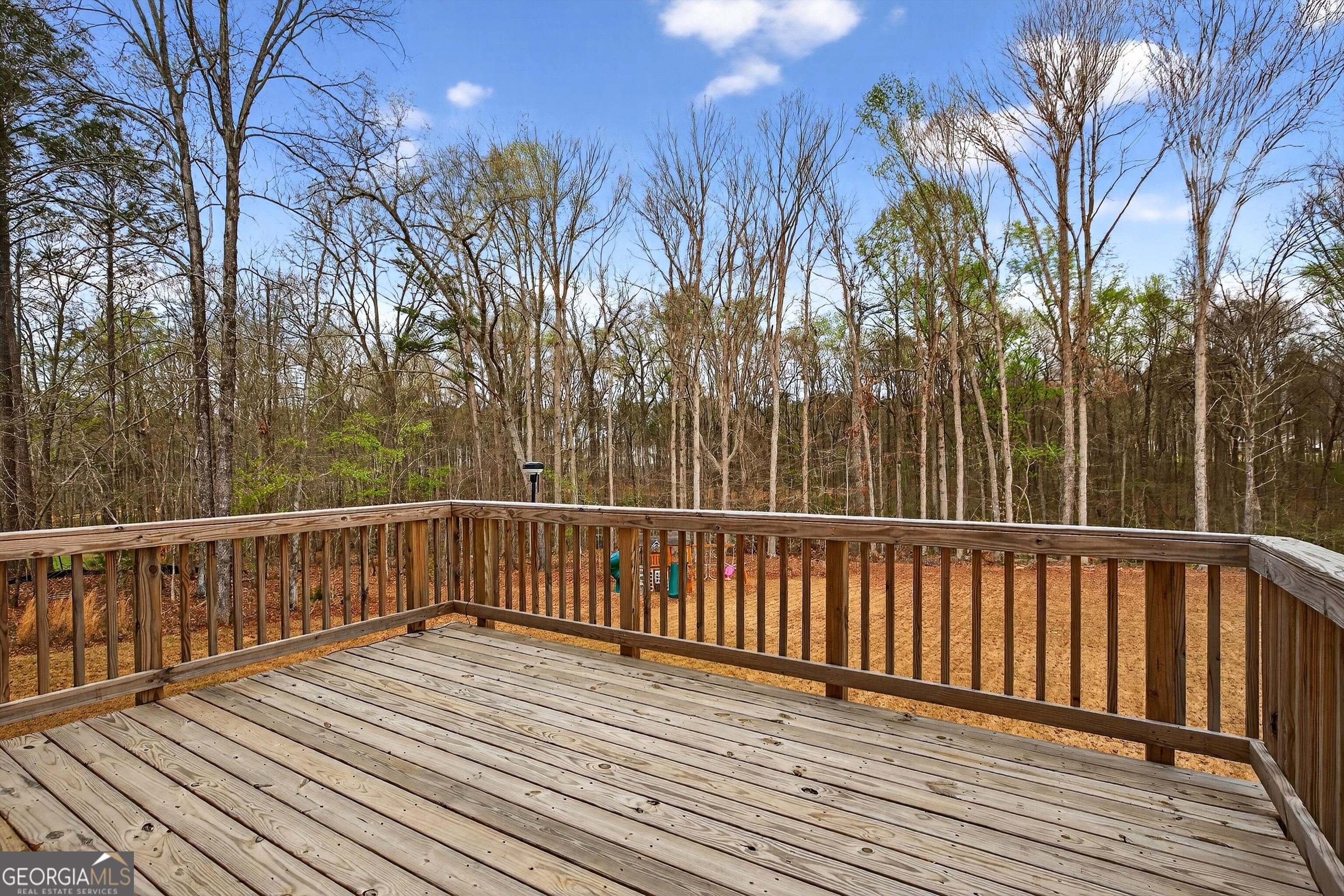 299 Saddleridge Trail Senoia, GA 30276 - Photo 48 of 56 a view of balcony with wooden floor and fence