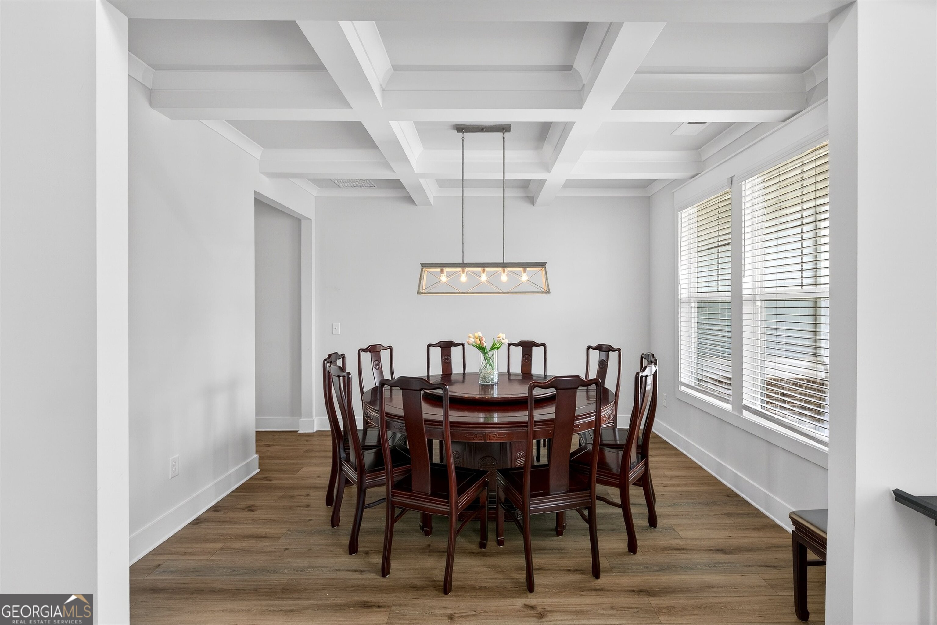 299 Saddleridge Trail Senoia, GA 30276 - Photo 5 of 56 a view of a dining room with furniture window and wooden floor