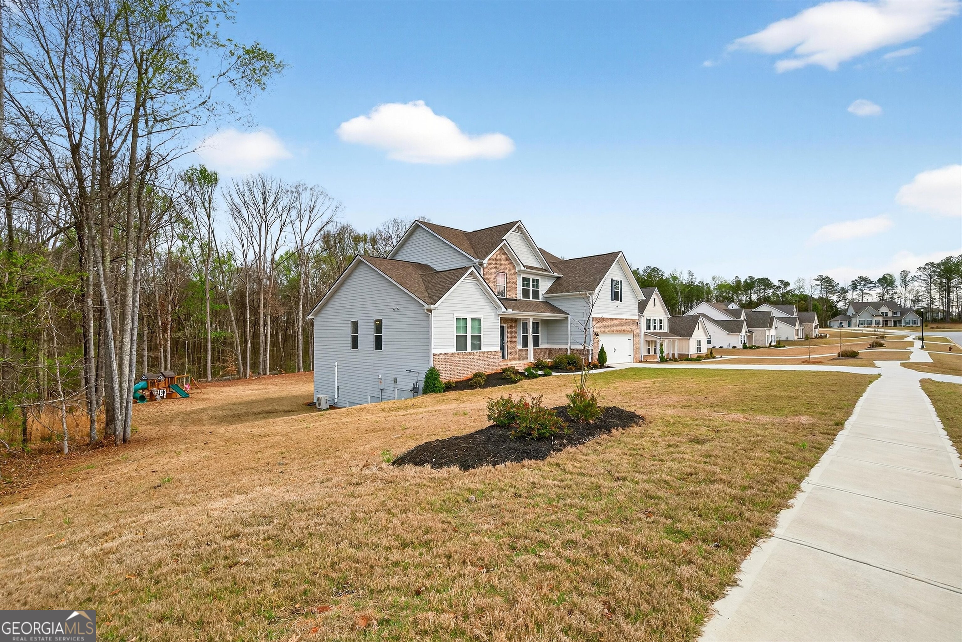 299 Saddleridge Trail Senoia, GA 30276 - Photo 55 of 56 a view of house with outdoor space and sitting area